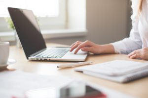 Woman at desk using laptop